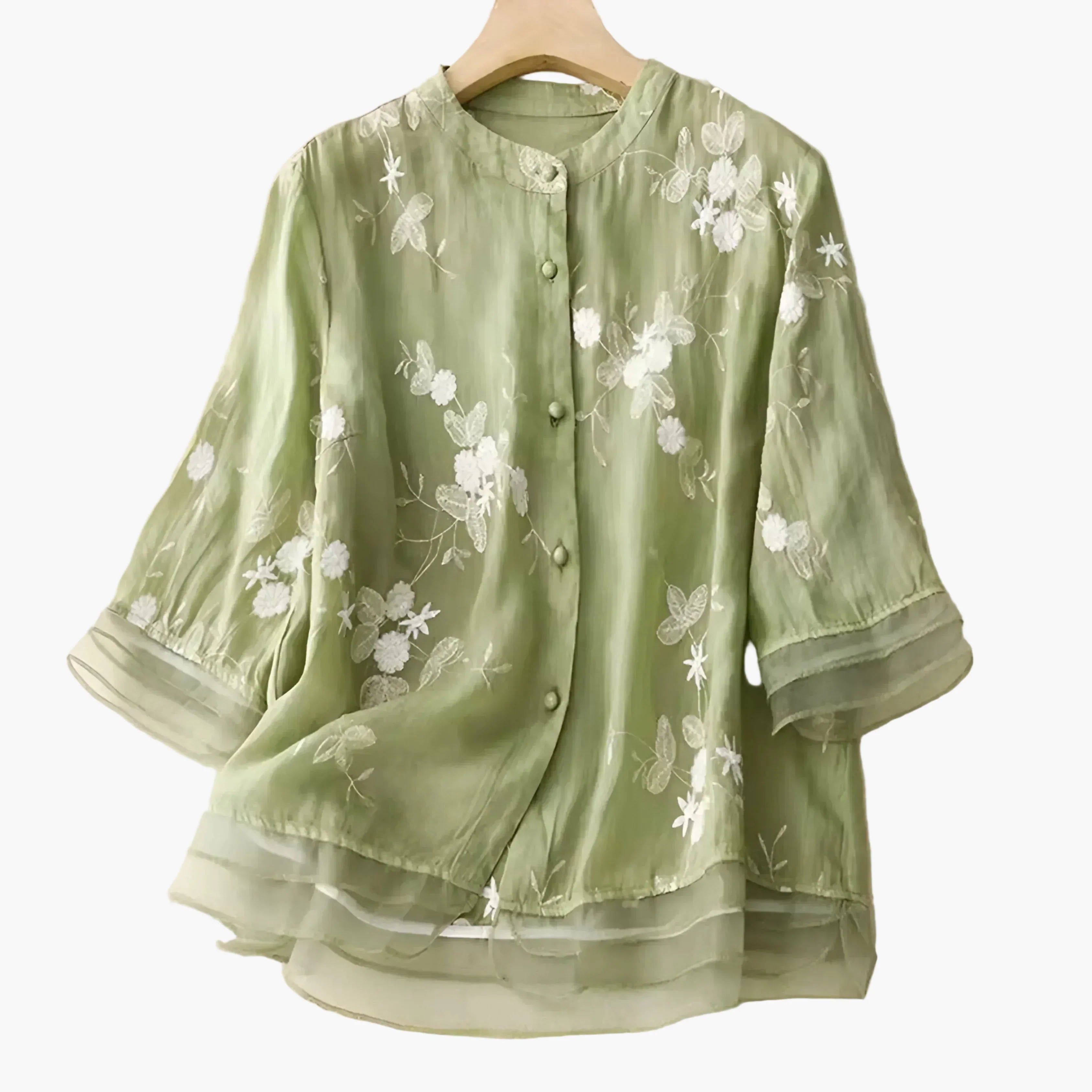 Damblus med broderade blommor och avslappnad