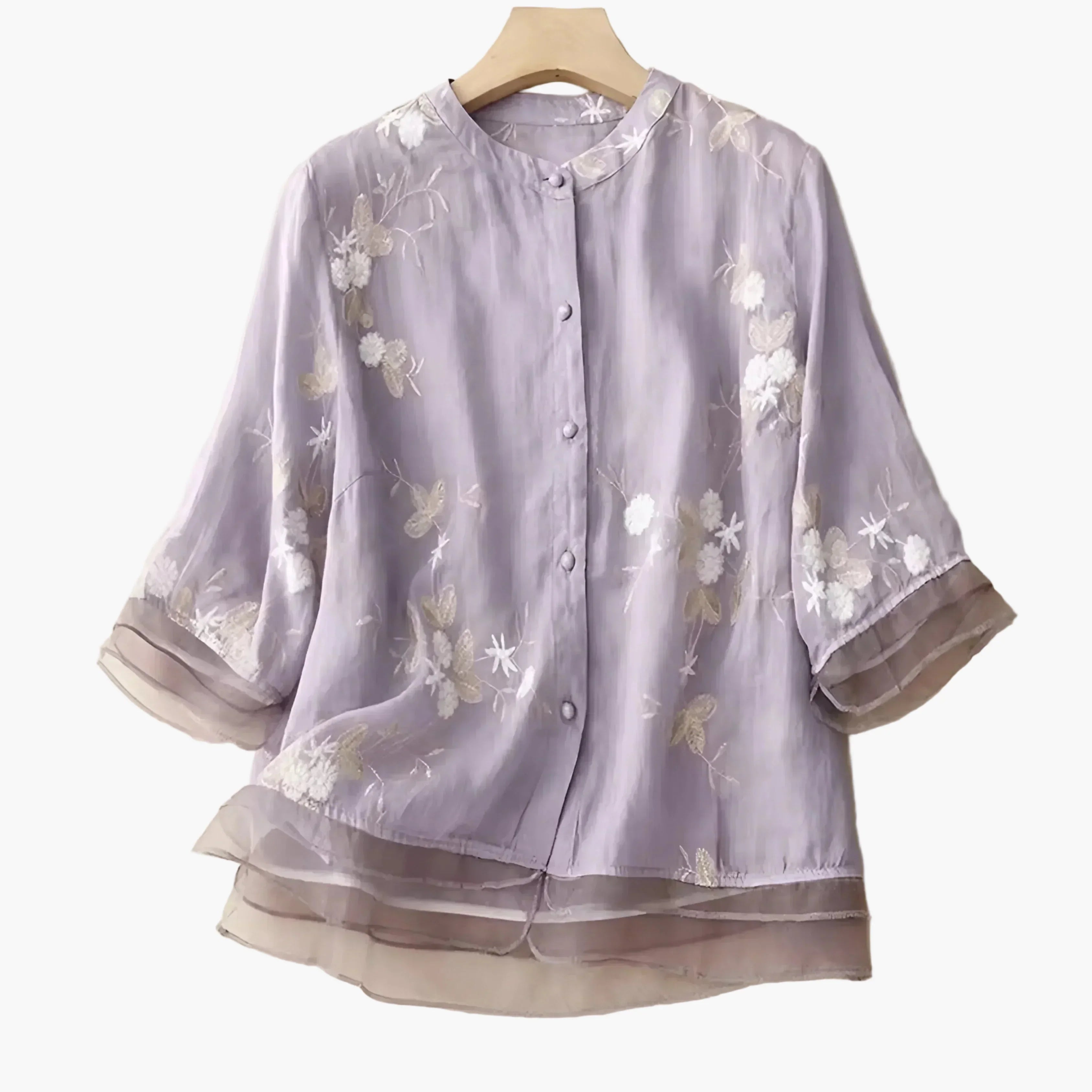 Damblus med broderade blommor och avslappnad